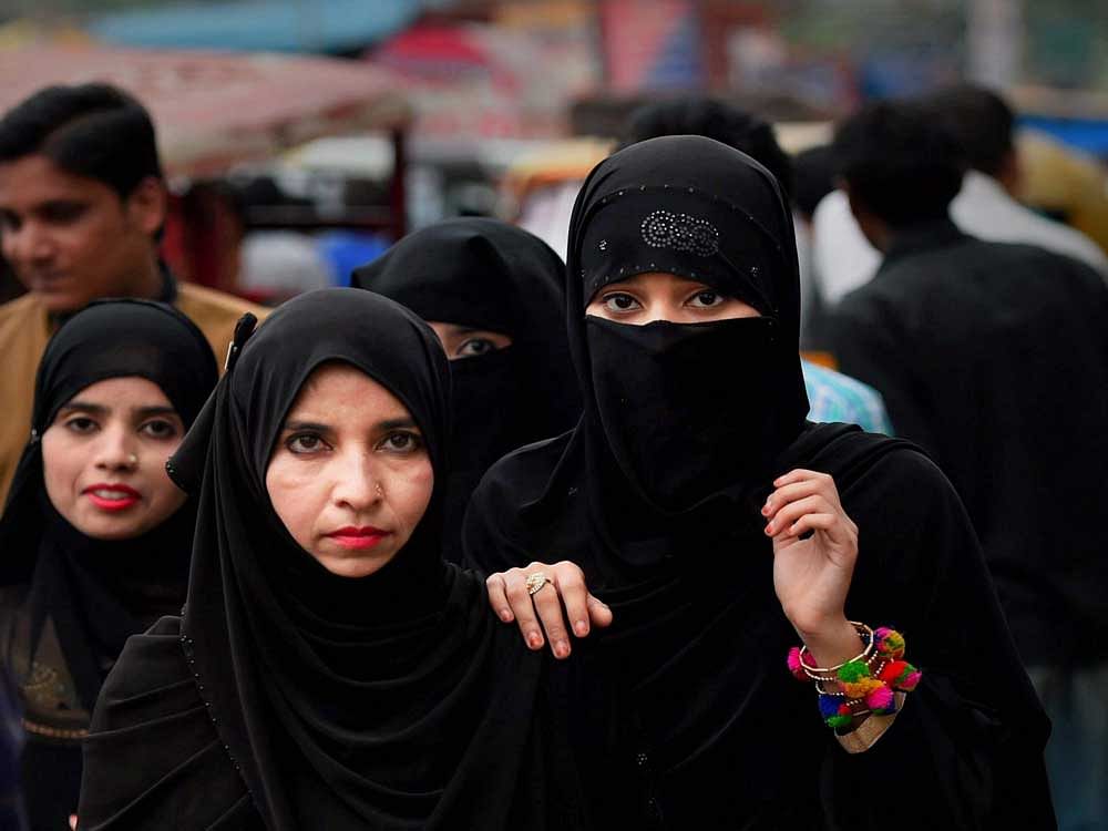 Muslim women at a market in old Delhi on Tuesday. The Supreme Court on Tuesday banned the 1,400 year-old practice of instant 'triple talaq' among Sunni Muslims. PTI Photo