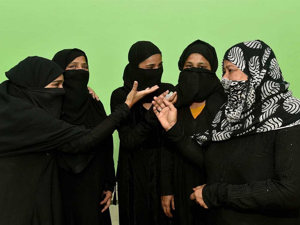 Muslim women react on the Supreme Court's decision on 'triple talaq' in Lucknow on Tuesday. PTI