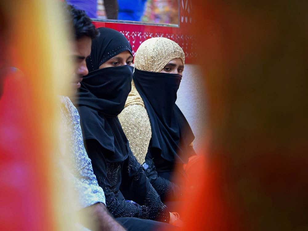 Muslim girls at a market in old Delhi on Tuesday. The Supreme Court on Tuesday banned the 1,400 year-old practice of instant 'triple talaq' among Sunni Muslims. PTI Photo