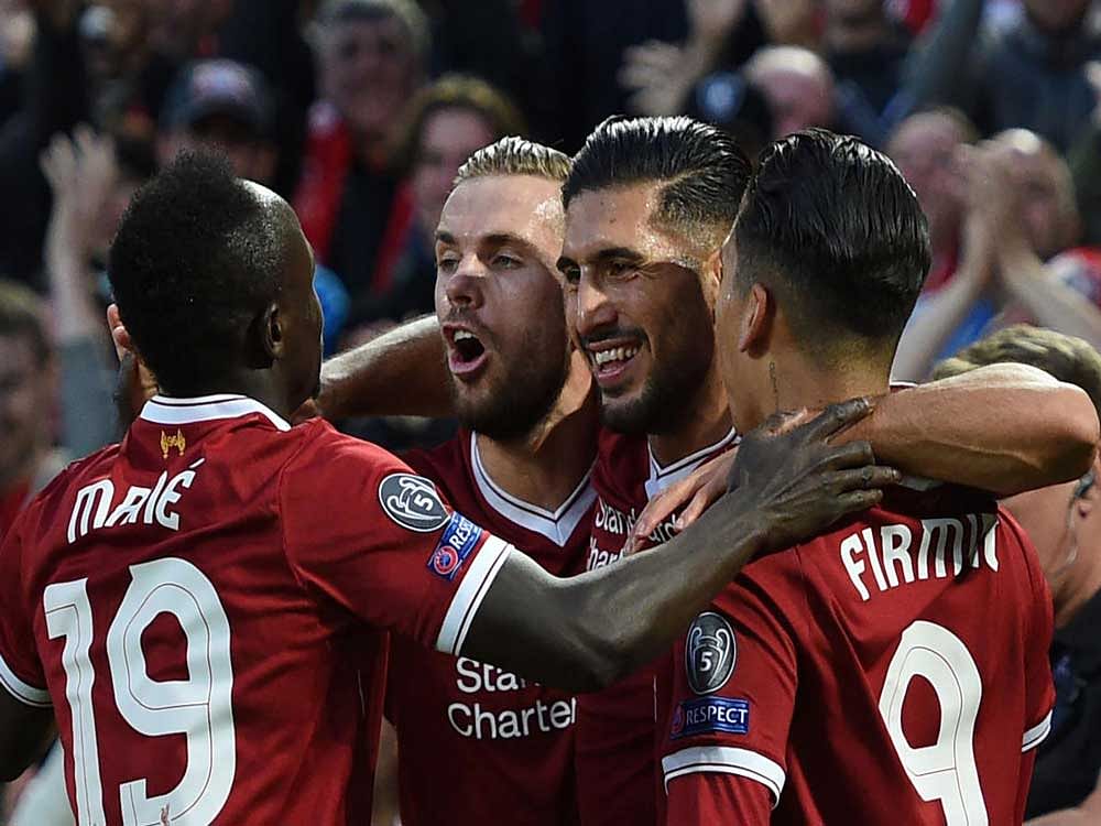DAZZLING SHOW: Liverpool's Emre Can (second from right) celebrates with team-mates after scoring against Hoffenheim on Wednesday. AFP