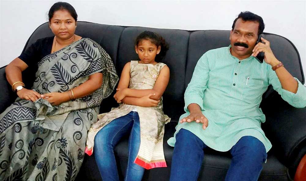 Former Jharkhand chief minister Madhu Koda with wife Geeta Koda and daughter. Koda and his family escaped unhurt after his car fell into a pit due to a tyre burst near Chaibasa under West Singhbhum district of Jharkhand. PTI photo.