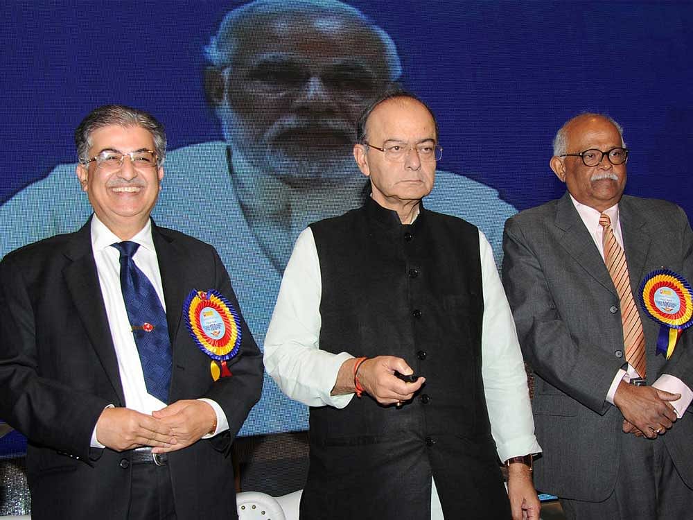 Union finance minister Arun Jaitley inaugurating thed Vijaya Bank 100 Digital Villages, 100 Branches and 100 ATMs simultaneously by pressed the buttion to officially declare open all the new entities, at Bangalore on Saturday. Also seen Dr. Kishore Sansi, MD & CEO of the Bank and G. Narayanan, Chairman of the bank. photo Srikanta Sharma R.