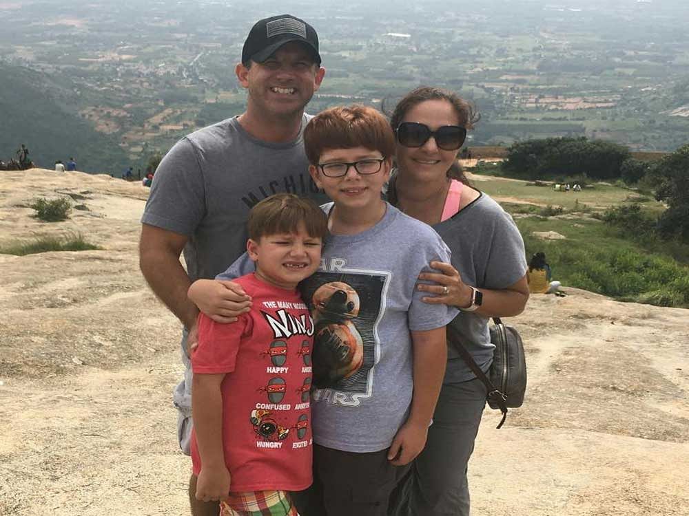 relaxed Zach and wife Norma Hosler with their sons Forrest and Zachary at Nandi Hills.
