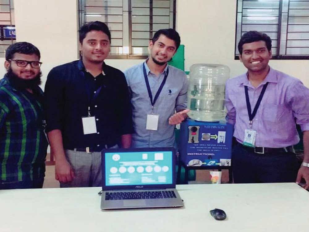 Students of ATME College of Engineering, Mysuru; D V Raghu, Gayaz Mohammed, Mohammed Mohiyuddin Shariff and M D Yaseen Ahmed with their low-cost coin-operated water dispenser.