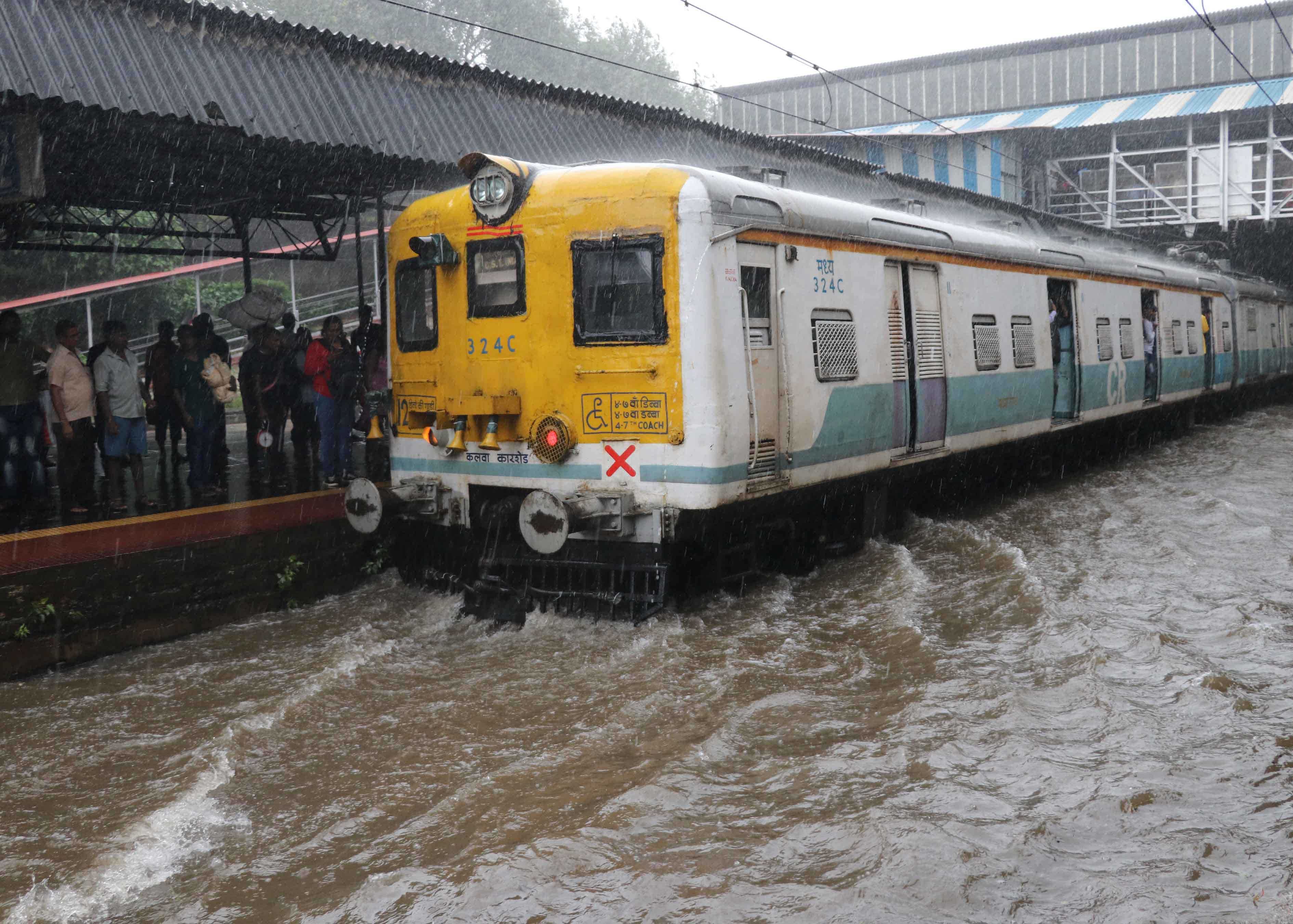 The flooded Sion station of Central Railway as heavy rains lashed Mumbai and its suburbs on Tuesday DH Photo