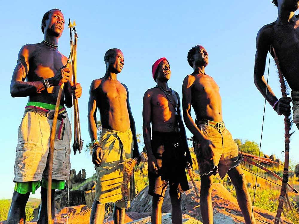 microbial cycle: An undated handout photo of members of the Hadza, a community of about 1,300 people, in Tanzania. A new study finds that the gut microbiome among the Hadza fluctuates with the season and with diet. nyt