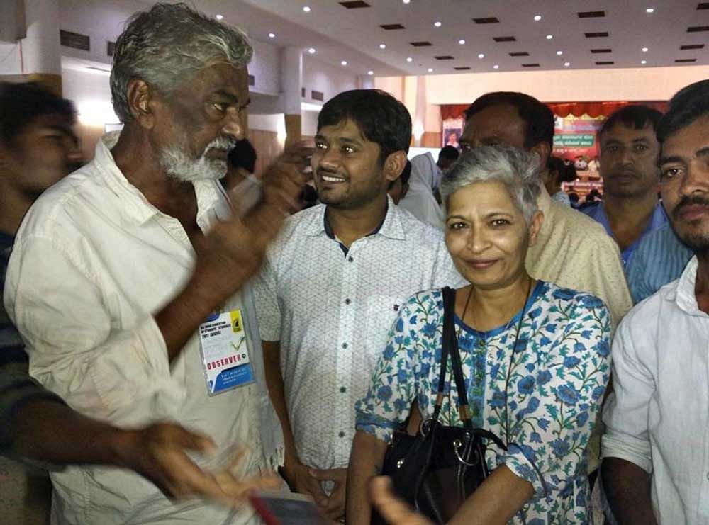 Gauri Lankesh with progressive thinker and Dalit writer Devanooru Mahadeva and JNU students'union leader Kanhaiya Kumar. DH File photo.