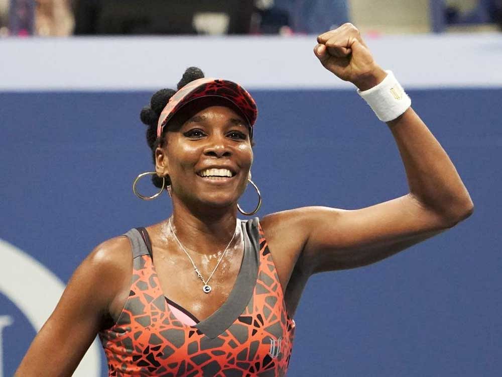 Venus Williams celebrates after defeating Czech Republic's Petra Kvitova in the quarterfinals on Tuesday. AFP Photo