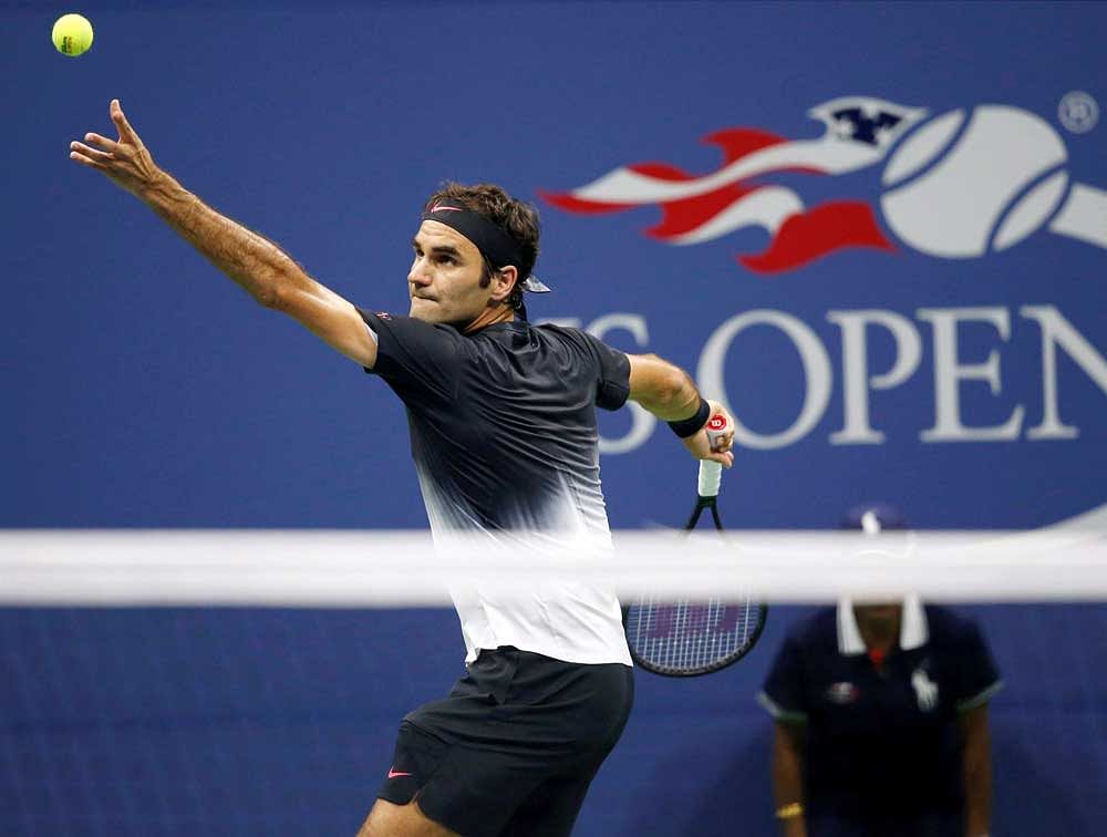 Roger Federer, of Switzerland, serves in the third set of a quarterfinal match against Juan Martin del Potro, of Argentina, at the U.S. Open tennis tournament in New York, Wednesday, Sept. 6, 2017. AP/ PTI