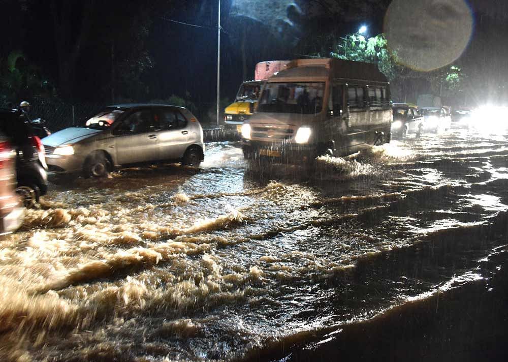 Water logged Mallya road during heavy rain in Bengaluru on Friday. DH Photo by Janardhan B K