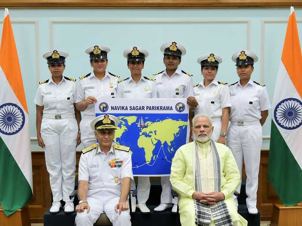Prime Minister Narendra Modi with the six women officers of the Indian Navy who are due to circumnavigate the globe. Chief of Naval Staff Admiral Sunil Lanba is also seen. Photo via Twitter.