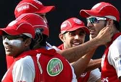 Kings XI Punjab's Yuvraj Singh (R) and team mates celebrate a wicket of Delhi Daredevils during their Indian Premier League-3 match in New Delhi on Sunday. PTI