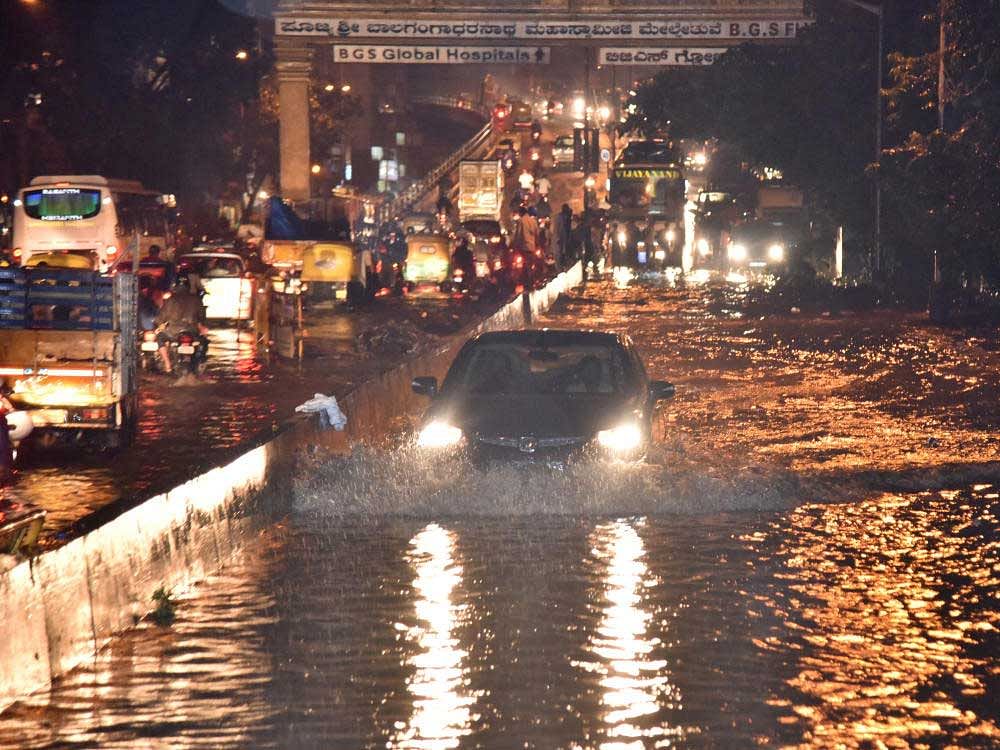Water logged Mysore road (Near Balagangadhara swamy flyover) during heavy rain in Bengaluru on Friday. Photo by Janardhan B K