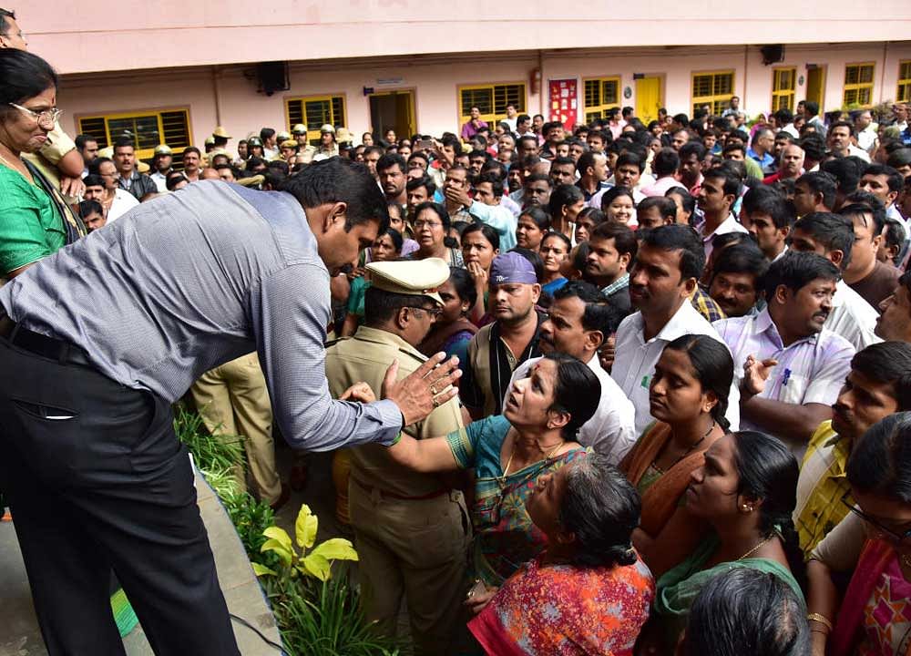 Parents are gathered in a large number to protest against the school, where a complaint that a 4 year girl sexually assaulted (Little Daffodils Kinder Garten), at St. Mary's Convent, T Dasarhalli, in Bengaluru on Wednesday. Photo