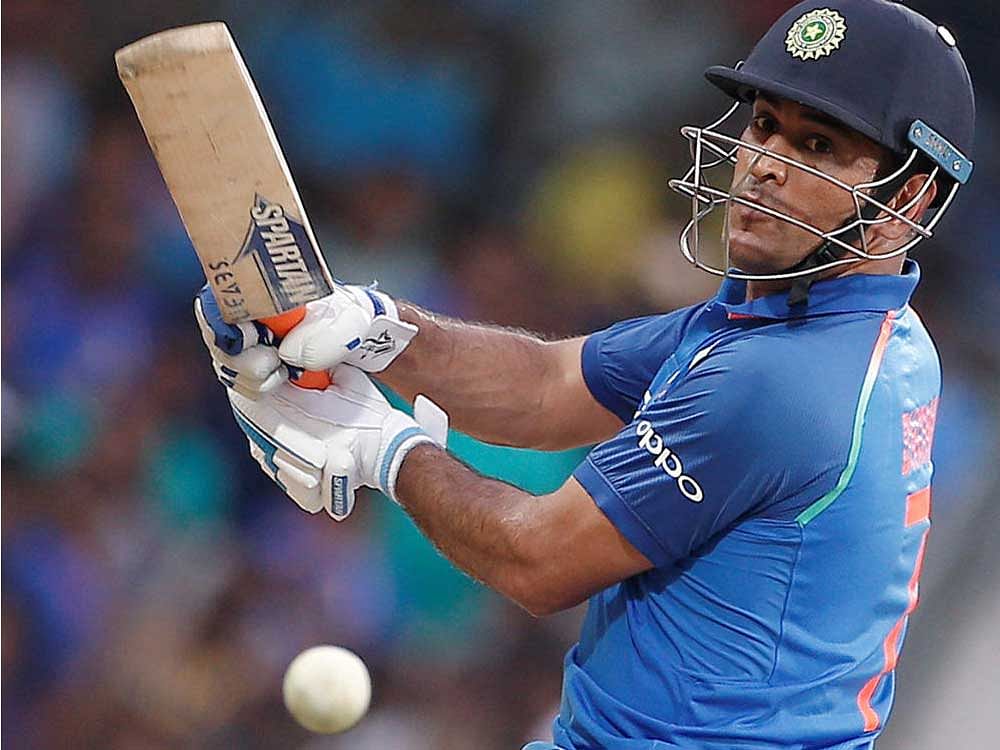 The 36-year-old Dhoni is now the 13th cricketer in the history of international cricket to complete a ton of 50's. Reuters File Photo