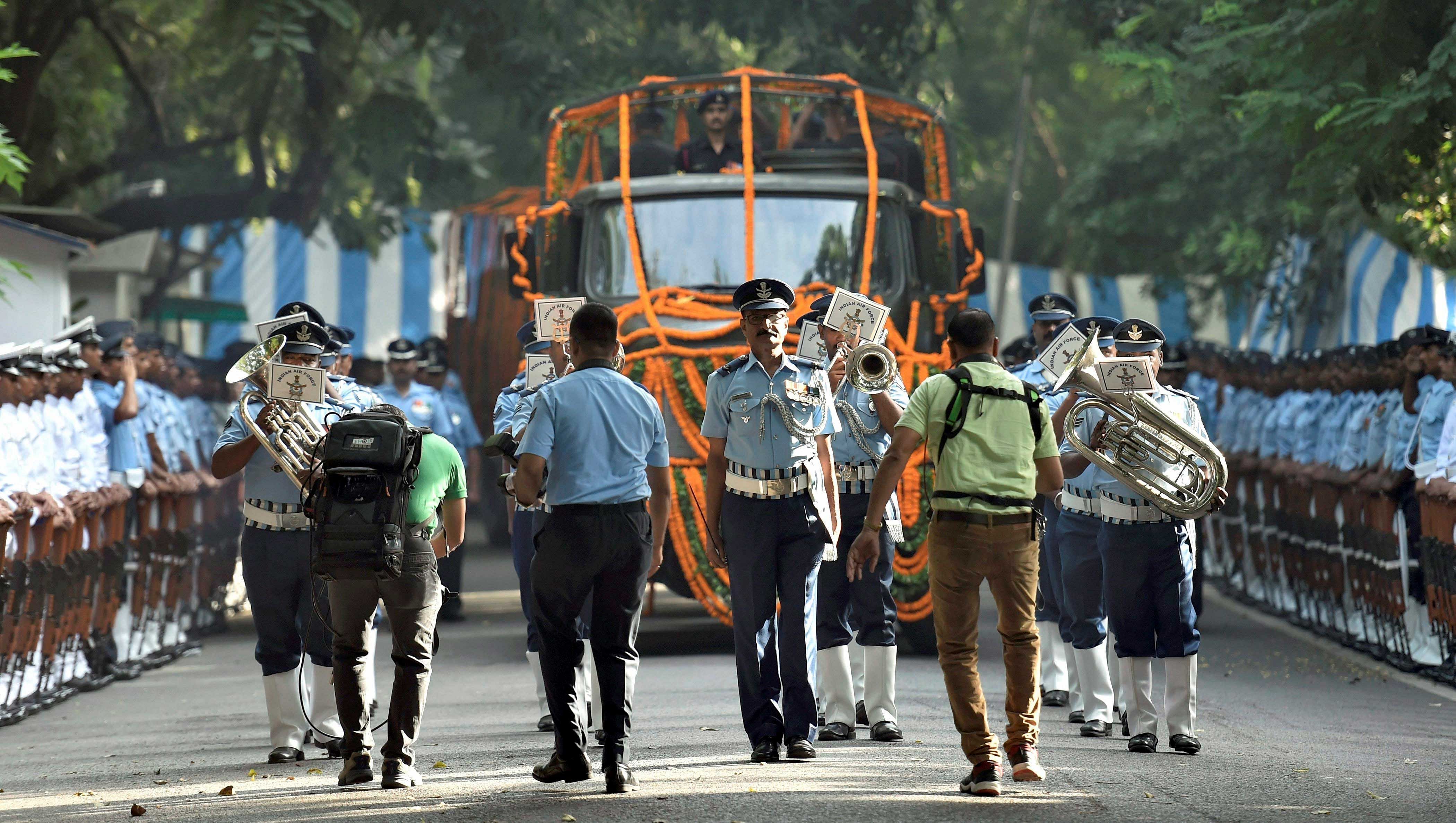 Defence personnel accompany the procession for the state funeral of Marshal of the Indian Air Force Arjan Singh in New Delhi on Monday. The final journey of the Marshal of the Indian Air Force Arjan Singh began today with the mortal remains being taken on a gun carriage to the Brar Square here for conducting last rites with state honours. PTI Photo