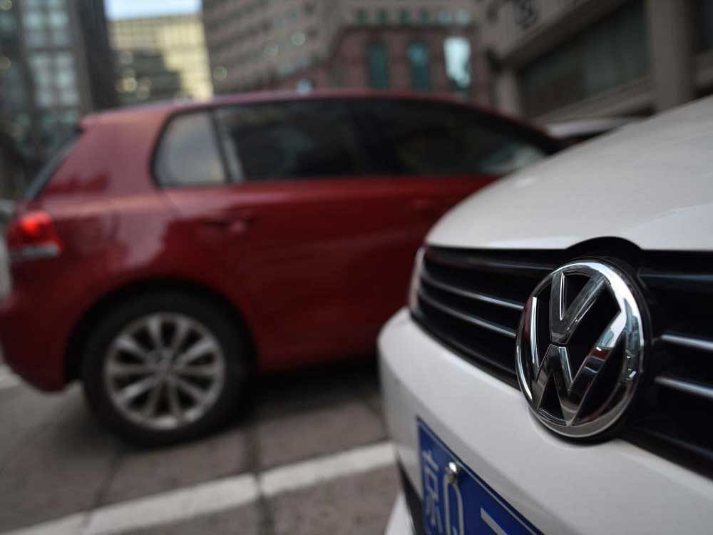 Volswagen cars are seen in a car park in Beijing on September 14, 2017. Volkswagen will recall almost five million vehicles in China over airbag concerns, Chinese authorities said on September 14, 2017, dealing a new blow to the German automaker in the world's largest car market. / AFP PHOTO / GREG BAKER