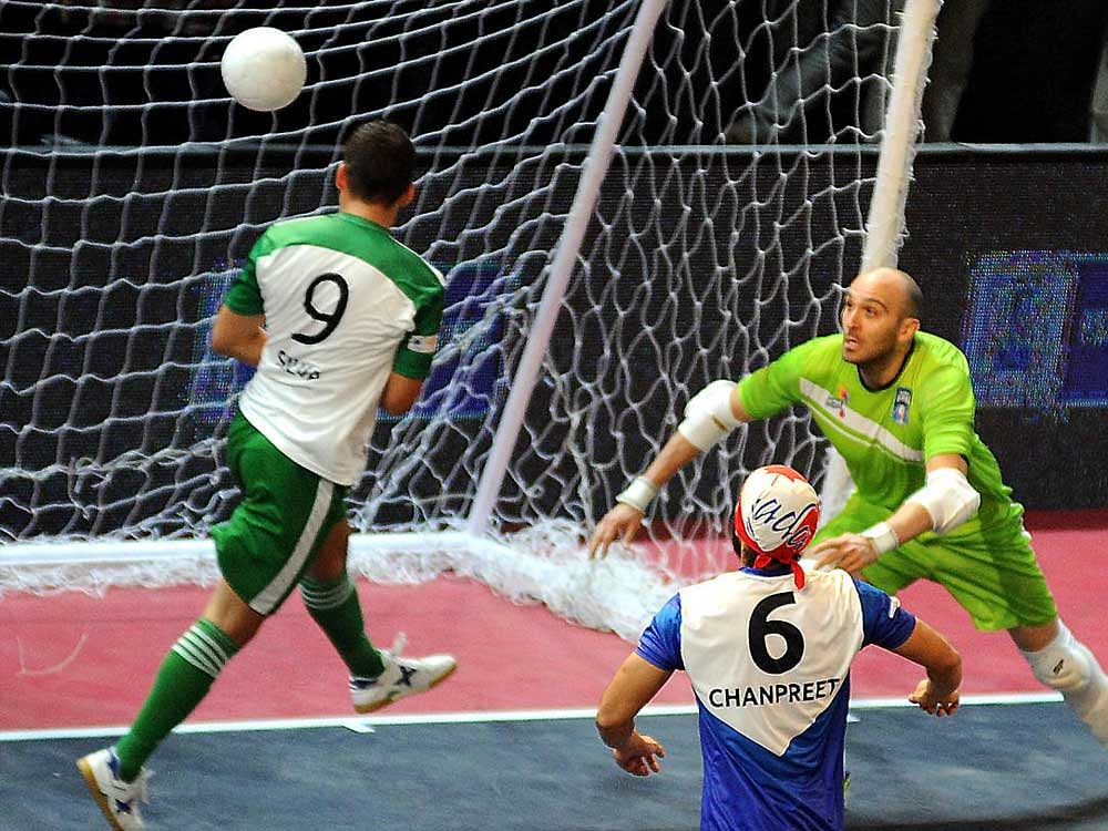 Jonothan of Bangalore Royals heading to score 1st goal for his team against Mumbai Warriers during their clash in the premier Futsal football league at Koramangala Indoor Stadium in Bengaluru on Tuesday. Photo Srikanta Sharma R.