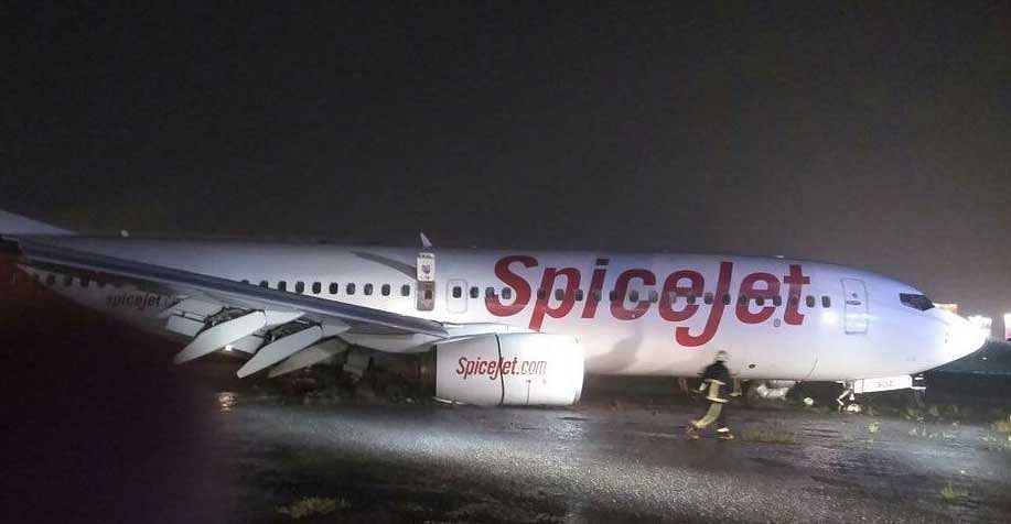 The SpiceJet Boeing 737 aircraft carrying 183 people overshot a wet runway while landing at the airport in rain-hit Mumbai and got stuck in the mud, officials said yesterday, adding that all passengers were safely evacuated. Picture courtesy Twitter