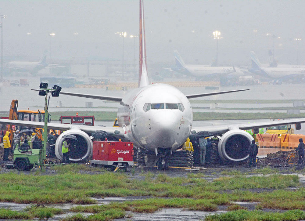The main runway of the Chhatrapati Shivaji International Airport was shut after an aircraft of Spice Jet overshot the runway and skidded into the mud. Seen here, the operations underway to retrieve the aircraft. DH Photo&#8203;