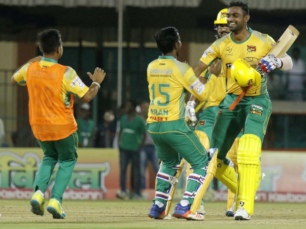 Bijapur Bulls' Abhimanyu Mithun (right) celebrates with team-mates after sealing the win with a boundary against Namma Shivamogga.