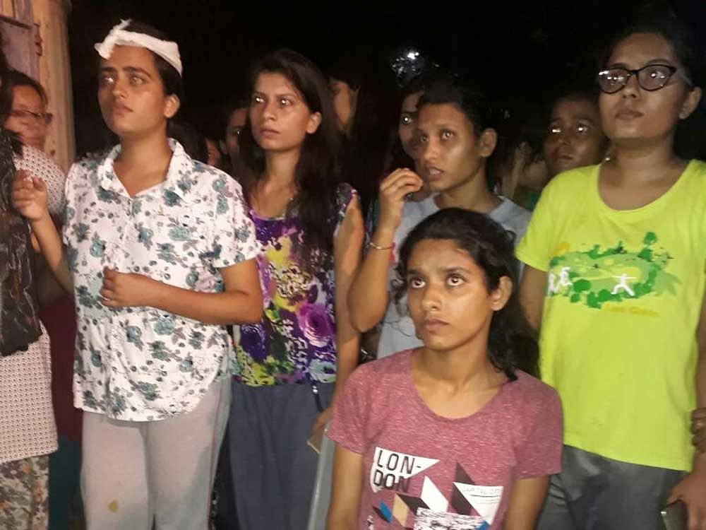 Eye witness accounts said that male cops carrying batons chased the girls into their hostels and thrashed them though the officials denied the charge. DH Photo