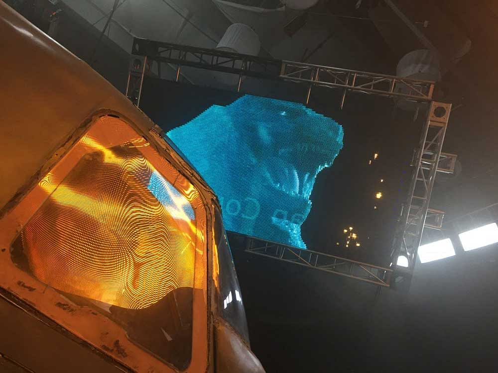 The photo shows a low-res CG render of Godzilla, roaring presumably at an airplane. Twitter/Mike_Doughtery.