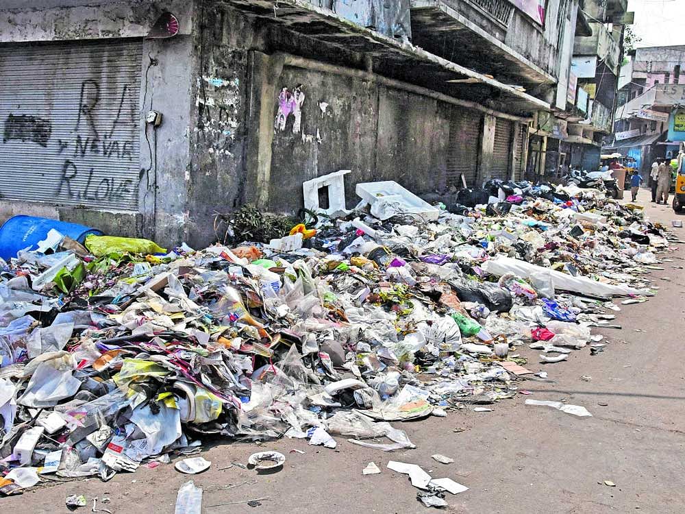 Uncleared garbage at 2nd 'A' Cross, JC Road, on Sunday.  DH Photo