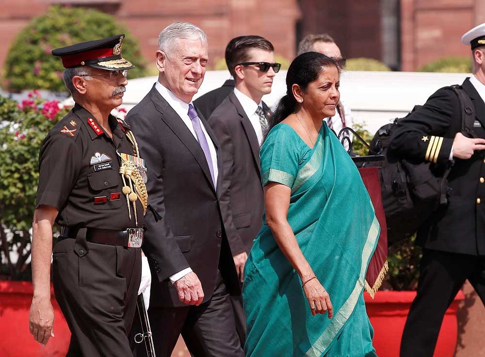 U.S. Defense Secretary Mattis inspects honour guard as India's Defence Minister Sitharaman looks on in New Delhi. Reuters Photo