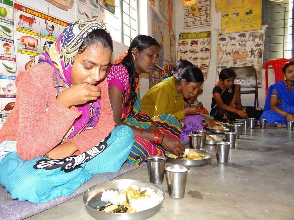 A file photo of women being provided with nutritious meal.