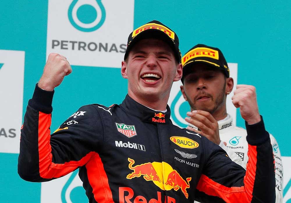 I have wings... Red Bull's Max Verstappen celebrates after winning the Malaysian Grand Prix. Reuters