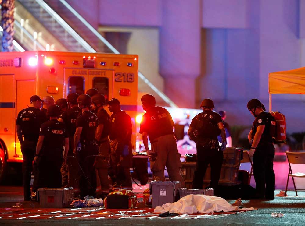A body is covered with a sheet in the intersection of Tropicana Avenue and Las Vegas Boulevard South after a mass shooting at a music festival on the Las Vegas Strip in Las Vegas, Nevada, U.S. October 1, 2017. REUTERS