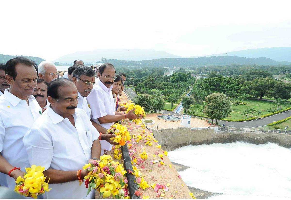 Ministers gathered at the Stanley reservoir showered flowers as the gates opened at 9 am and water gushed forth. The dam had reached 94.84 feet against its total capacity of 120 feet when the sluice gates were opened. DH photo