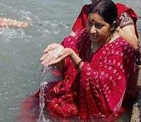BJP leader Sushma Swaraj takes bath in river Ganges on the occasion of Baisakh festival, in Haridwar on Tuesday. PTI