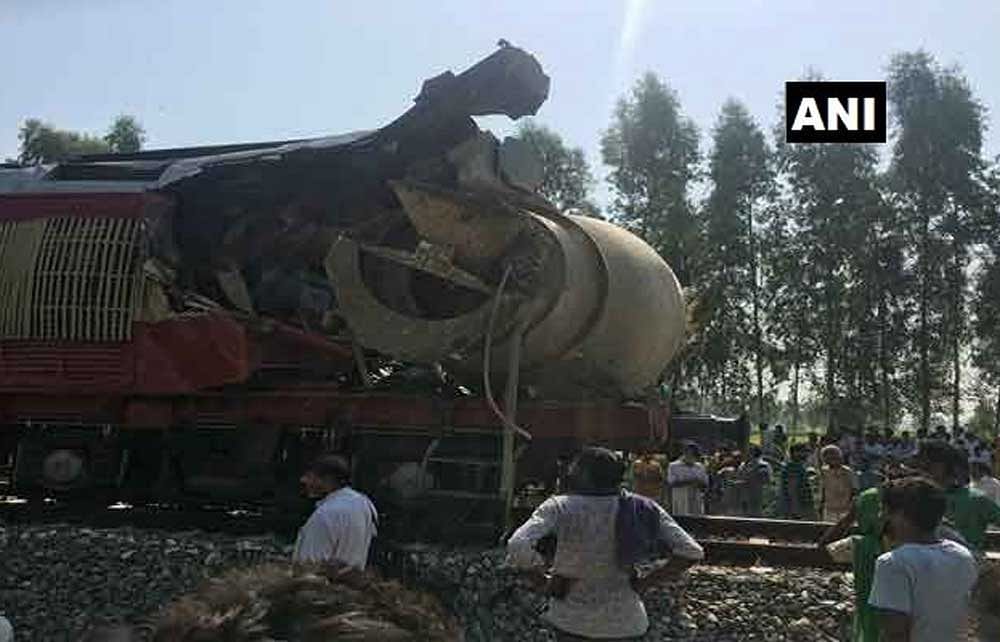 The mangled remains of the locomotive, with the mixer truck still attached to it. ANI photo.