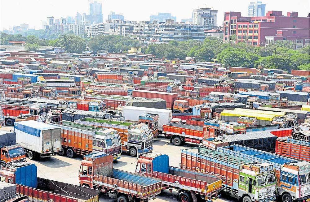 Trucks are seen parked during truck operators strike over GST (Goods and Services Tax) at Truck Terminal APMC Vashi in Navi Mumbai on Monday. PTI