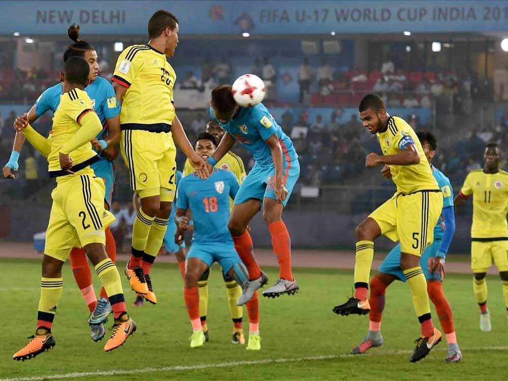 Jeakson Thounaojam heads in India's first goal during the FIFA U-17 World Cup match against Colombia on Monday. PTI