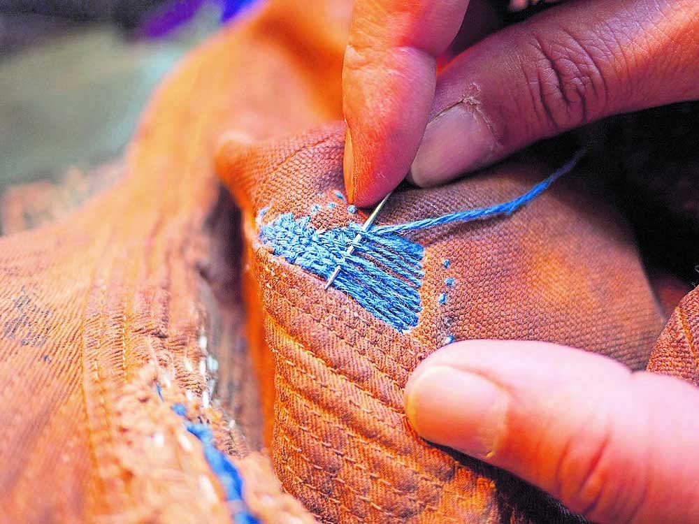 INTRICATE (Clockwise) Darning in progress; a Kani shawl; a sojnikar embroidering a shawl in Kashmir; visible darning. Photo courtesy: Dinesh Khanna & priya mehra