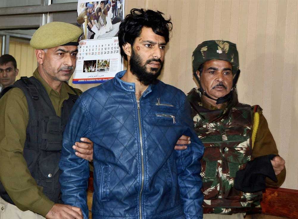 Lashkar-e-Toiba militant Khurseed being presented by police at a joint press conference with Army and CRPF, in Srinagar on Monday. PTI Photo