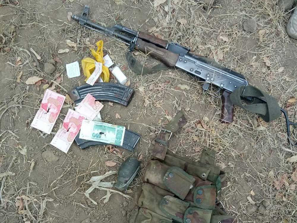 The security forces recovered an AK-47, ammo, and Pakistani currency from the felled militant. ANI photo.