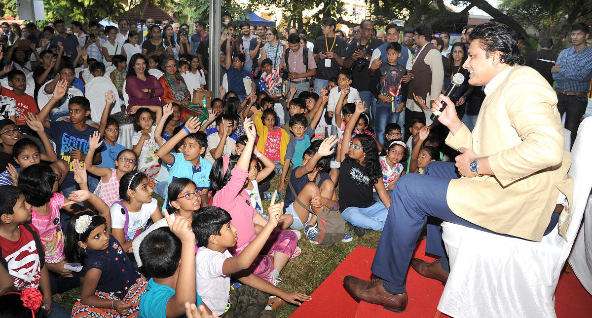 Cricketer Anil Kumble intraction with the kids on Wildlife and photography at the Bangalore Literature Festival in Bengaluru on Saturday. Photo Srikanta Sharma R.