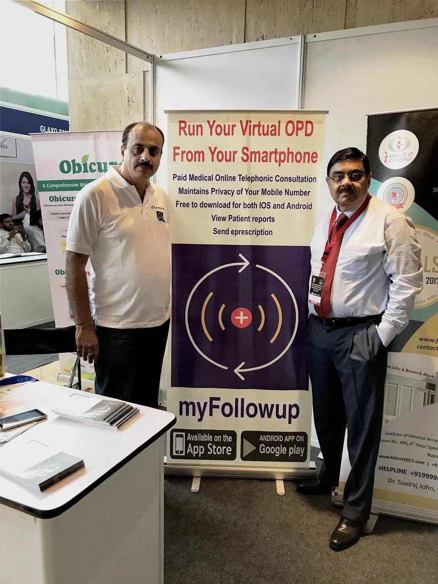 Doctors display a banner informing people of a newly launched mobile app - myFollowup - for patients living in far off places, at Sir Ganga Ram Hospial in New Delhi. PTI