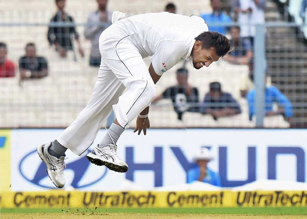 Sri Lankan bowler Suranga Lakmal in action during the first day of the 1st cricket test match against India at Eden Gardens in Kolkata on Thursday. PTI Photo