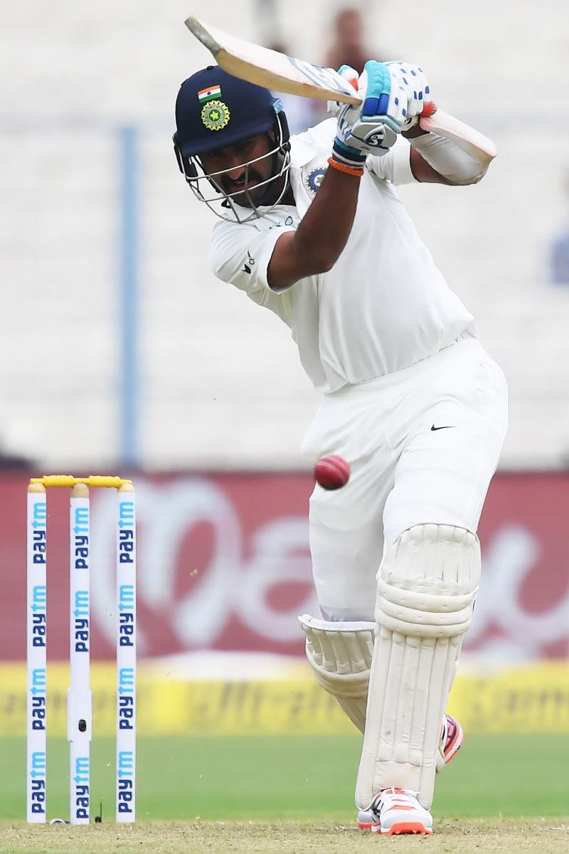 STANDING TALL: India's Cheteshwar Pujara drives one to the fence during his unbeaten 47 against Sri Lanka on Friday. AFP