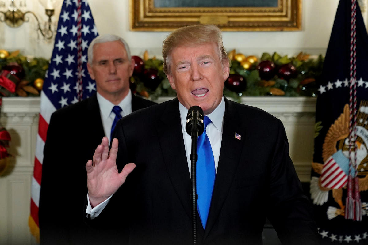 U.S. President Donald Trump, flanked by Vice President Mike Pence, delivers remarks recognizing Jerusalem as the capital of Israel at the White House in Washington, U.S. December 6, 2017. REUTERS