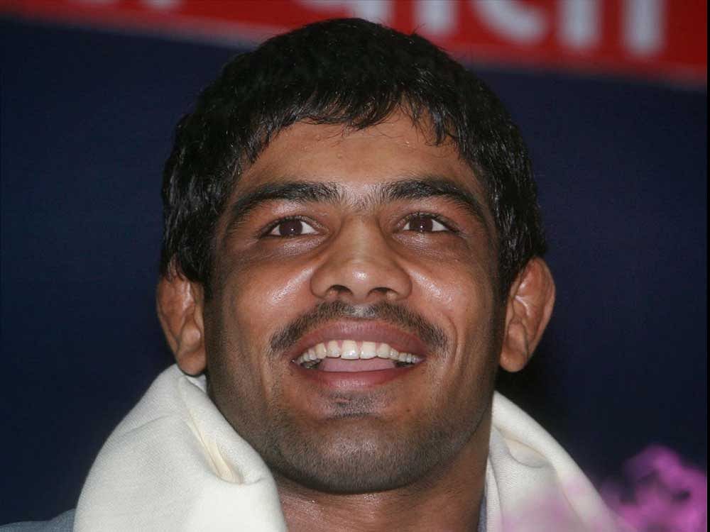Returning to international wrestling after more than three years, Sushil defeated New Zealand's Akash Khullar via pinfall in the final of the 74kg freestyle category to clinch the yellow metal. DH File photo.