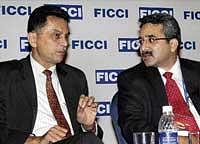 Sebi Chairman  C B Bhave (left) and MCX Stock Exchange MD & CEO of Joseph Massey, in Mumbai, on Tuesday. PTI