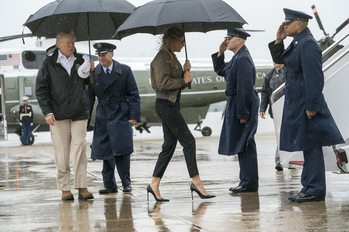 FILE - First lady Melania Trump wears stiletto heels as she and the president boarded Air Force One to visit hurricane-hit Texas, at Joint Base Andrews in Maryland, Aug. 29, 2017. The first lady was mocked for the choice; in a year of reckoning for women on many fronts, high heels may be headed for a tumble. (Doug Mills/The New York Times)