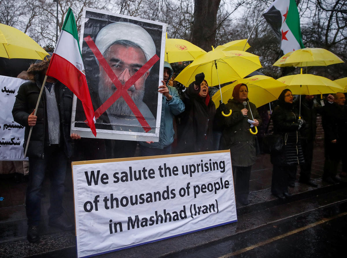 Opponents of Iranian President Hassan Rouhani hold a protest outside the Iranian embassy in west London, Britain. REUTERS