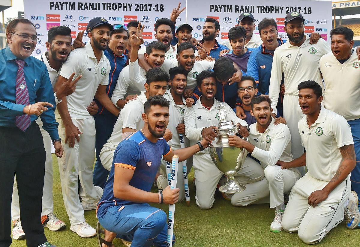 OVER THE MOON Vidarbha players celebrate after winning the Ranji Trophy against Delhi in Indore on Monday. PTI